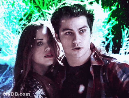 Man And Woman Standing Together Looking At Camera GIF