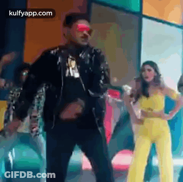 Man And Woman Standing Together On Stage GIF