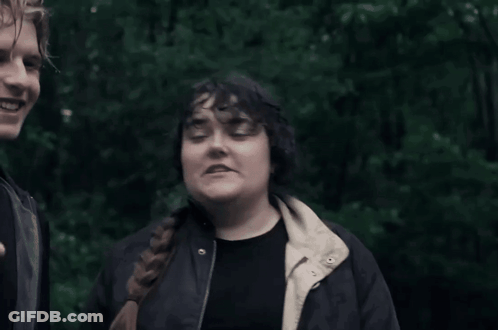 Man And Woman Standing Together Woman In Black Jacket GIF