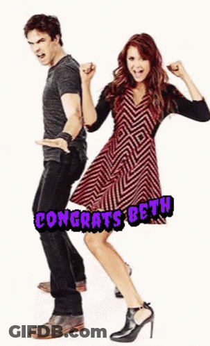 Man And Woman Standing Together Woman In Chevron Dress GIF