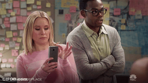 Man And Woman Standing Together Woman Looking At Phone GIF