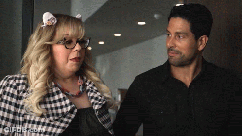 Man And Woman Standing Together, Woman Wearing Glasses GIF