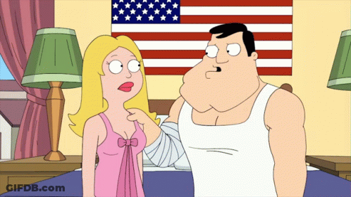 Man And Woman Standing With American Flag GIF