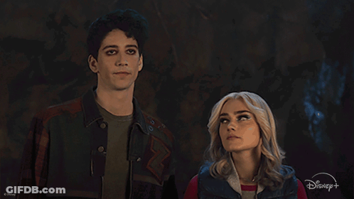 Man And Woman Standing With Disney Logo GIF