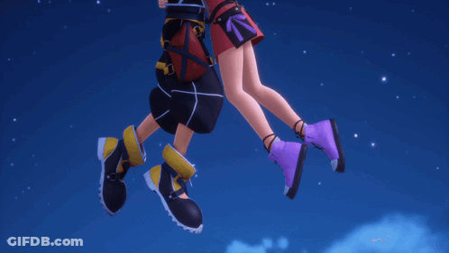 Man And Woman Standing With Legs Crossed GIF