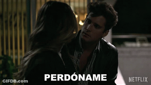 Man And Woman Standing With Perdoname GIF