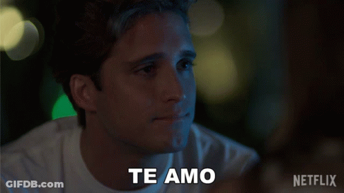 Man And Woman Standing With Perdoname Text GIF
