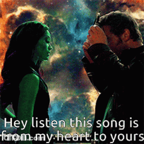 Man And Woman Standing With Text Hey Listen This Song Is From My Heart To Yours GIF