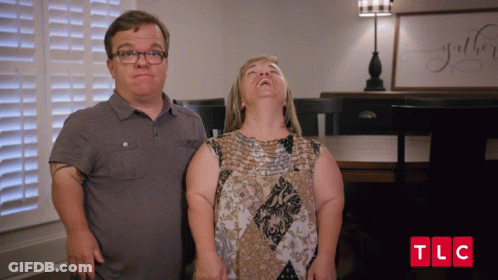 Man And Woman Standing With TLC GIF