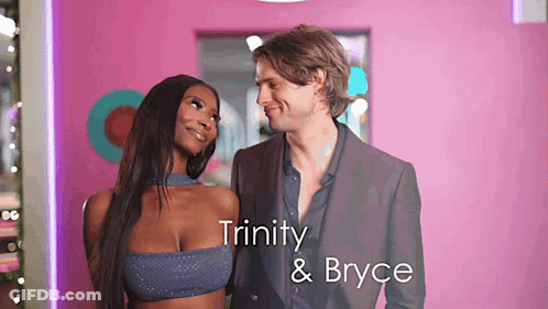 Man And Woman Standing With Trinity And Bryce GIF