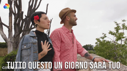 Man And Woman Standing With Tutto Questo Un Giorno Sara Tuo GIF