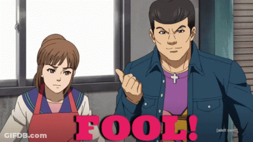 Man And Woman Standing With Word Fool GIF