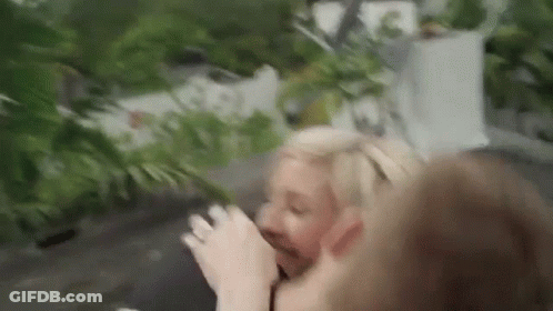 Man And Woman Standing, Woman Drinking GIF