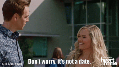 Man And Woman Standing, Woman Saying Don't Worry It's Not A Date GIF