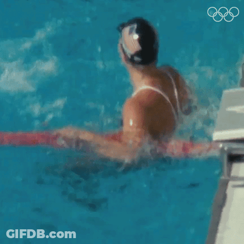 Man And Woman Swimming In Pool GIF