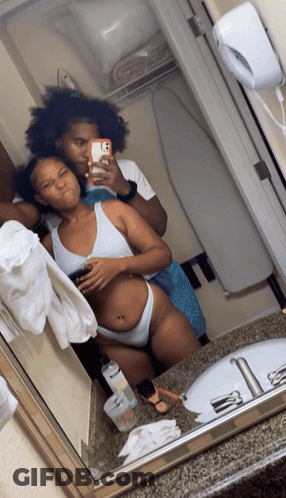 Man And Woman Taking Bathroom Selfie GIF