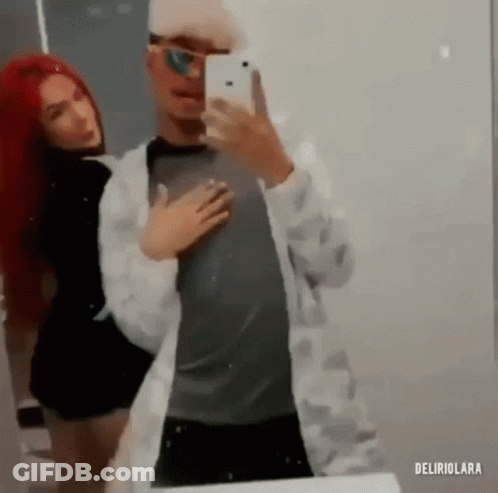 Man And Woman Taking Selfie In Mirror GIF