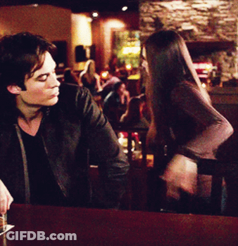 Man And Woman Talking At Bar GIF