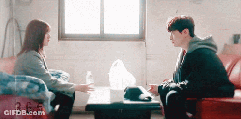 Man And Woman Talking At Table GIF