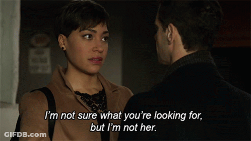 Man And Woman Talking I'm Not Sure What You're Looking GIF