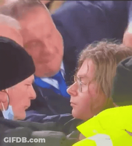 Man And Woman Talking In Crowd GIF