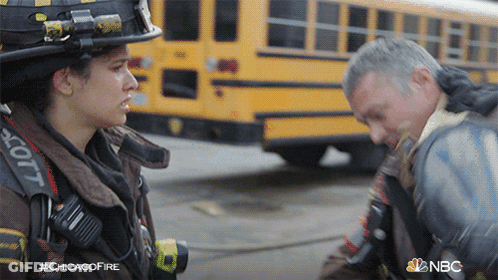 Man And Woman Talking In Front Of Yellow School Bus #Chicagofire GIF