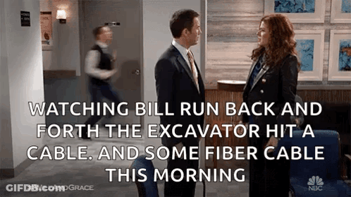 Man And Woman Talking In Hallway GIF