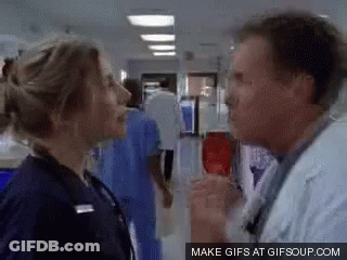 Man And Woman Talking In Hallway GIF