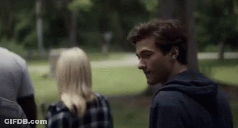Man And Woman Talking In Park GIF