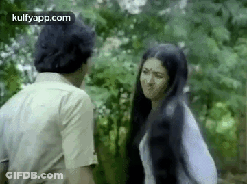 Man And Woman Talking In Woods GIF