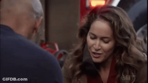 Man And Woman Talking Next To Fire Truck GIF