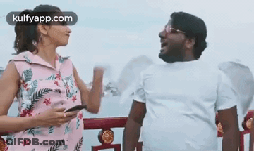 Man And Woman Talking On Balcony GIF