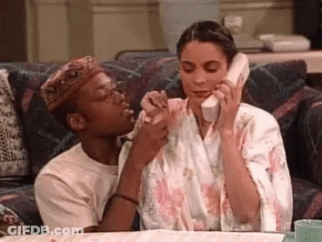 Man And Woman Talking On Cell Phone GIF