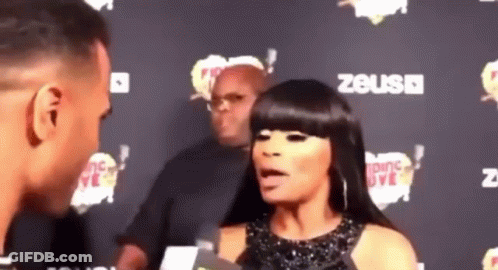 Man And Woman Talking On Red Carpet GIF
