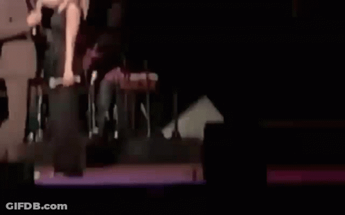 Man And Woman Talking On Stage GIF
