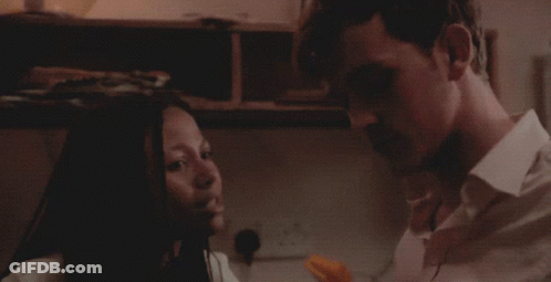 Man And Woman Talking Woman Holding Paper GIF