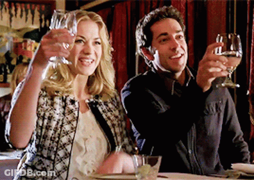 Man And Woman Toasting With Wine Glasses In Restaurant GIF