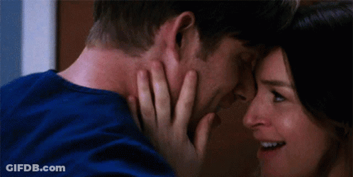 Man And Woman Touching Each Other's Faces And Smiling GIF