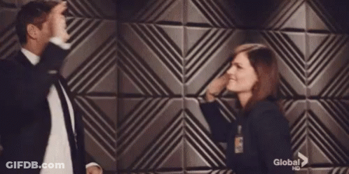 Man And Woman Touching Faces GIF