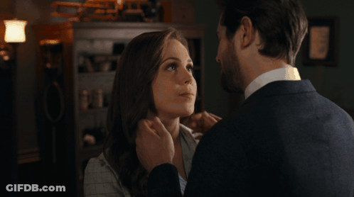 Man And Woman Touching Faces GIF