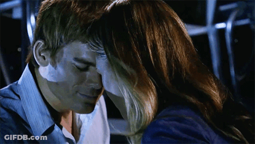 Man And Woman Touching Foreheads In Dark Room GIF