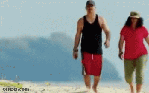 Man And Woman Walking Beach GIF