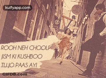 Man And Woman Walking Down Narrow Street GIF