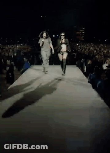 Man And Woman Walking Down Runway GIF