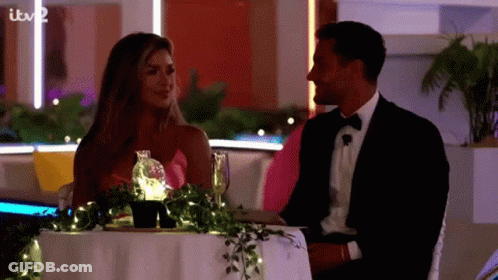Man And Woman Walking Down Sidewalk GIF
