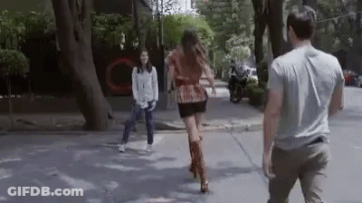 Man And Woman Walking Down Street GIF
