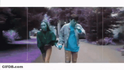 Man And Woman Walking Hand In Hand GIF