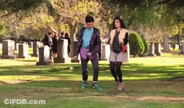 Man And Woman Walking In Cemetery GIF