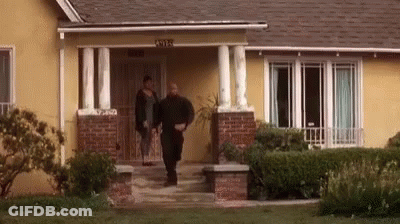 Man And Woman Walking Into House GIF