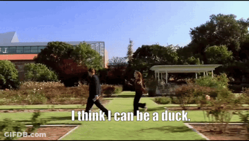 Man And Woman Walking Saying I Think I Can Be A Duck GIF